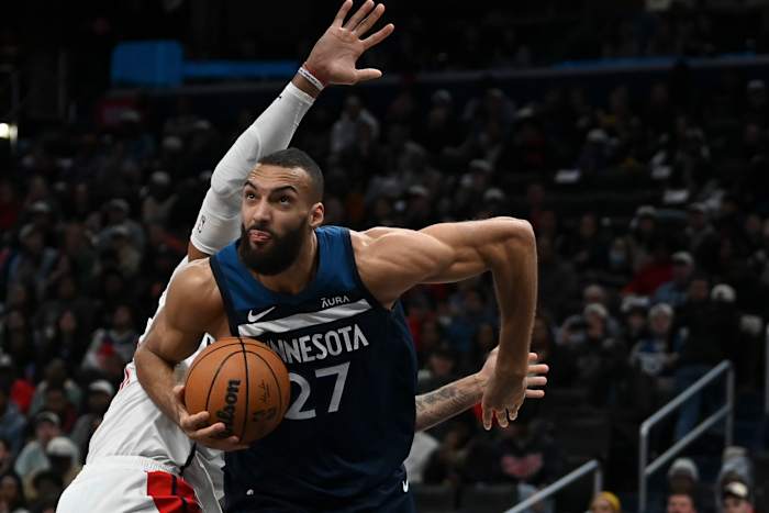 Jan 24, 2024; Washington, District of Columbia, USA; Minnesota Timberwolves center Rudy Gobert (27) moves past Washington Wizards center Daniel Gafford (21) during the first half at Capital One Arena.